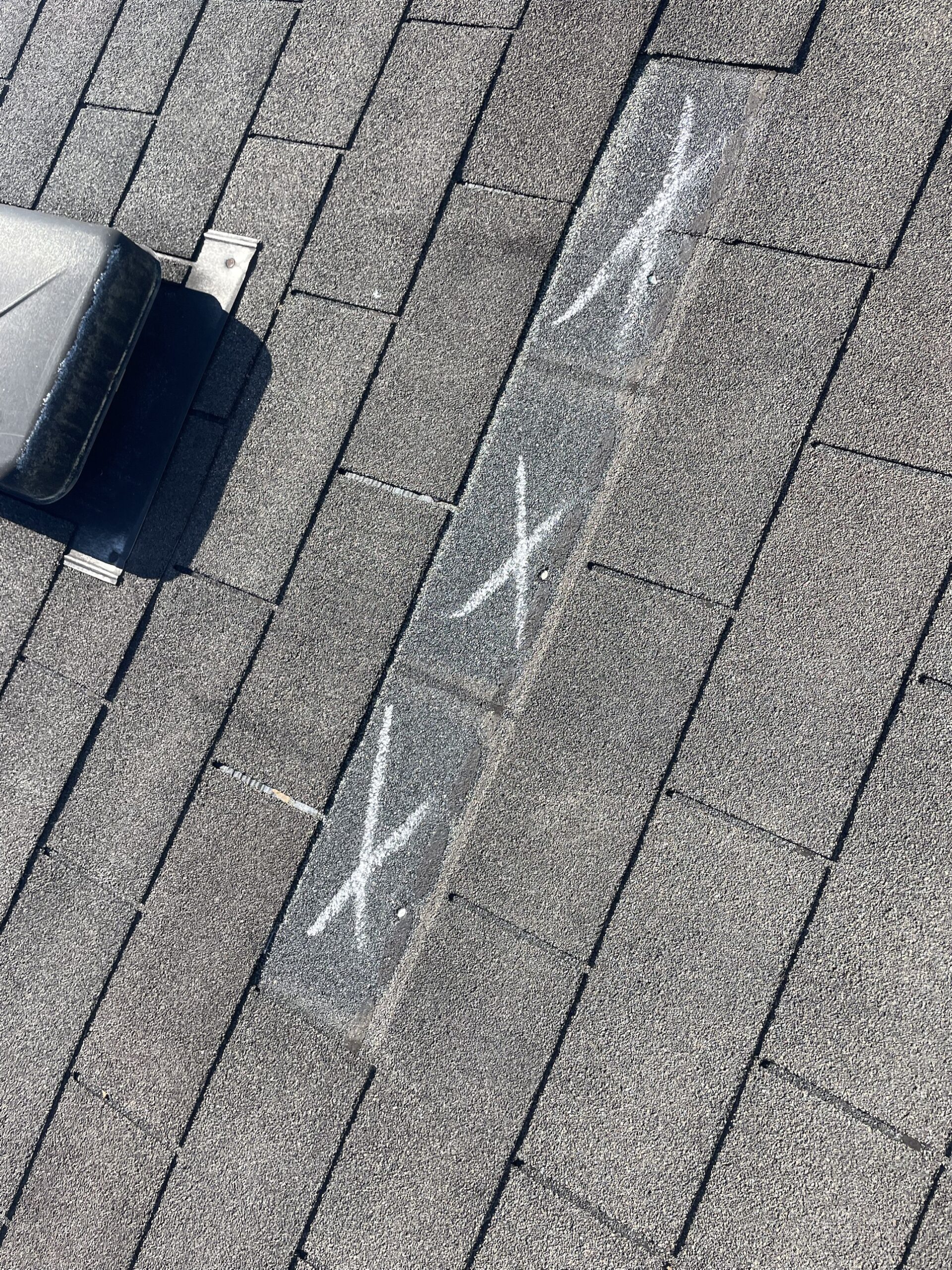 Wind damage marked with chalk during the repair test on the Rialto Way roof