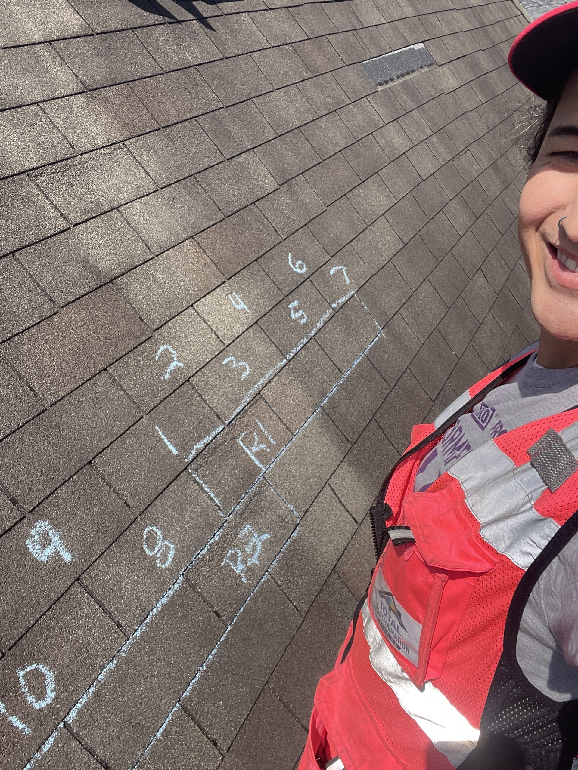 Numbered repair test squares marked on the Rialto Way roof